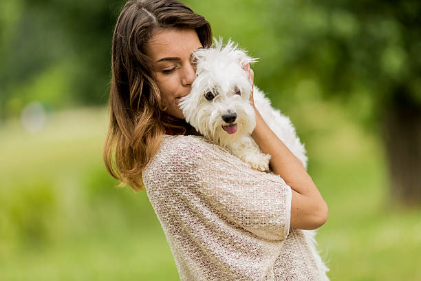 istock Young woman with a dog 512921085