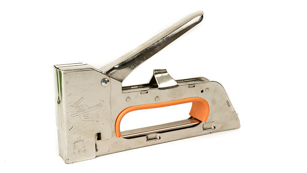 istock Stainless steel staple gun tacker isolated on white background 512921705