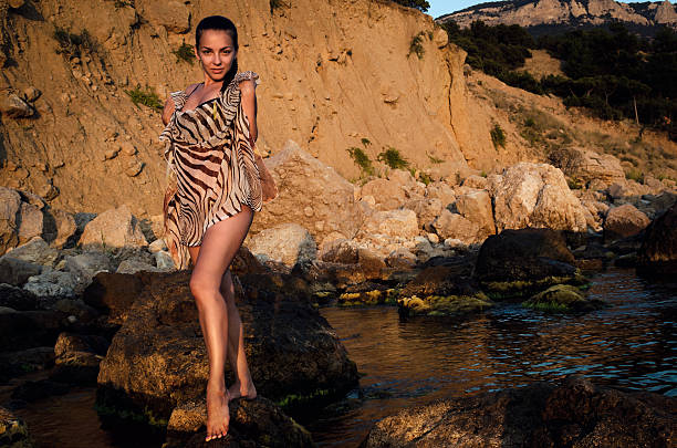 istock Young woman  on a rock 512922159