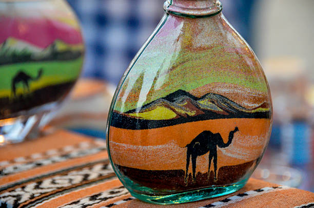 sand art in miniature glass bottles