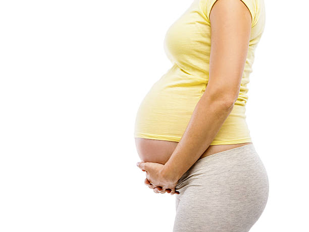 istock Unrecognizable pregnant woman isolated on white 512922195