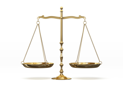 Gold scales of justice isolated on white background with clipping path.