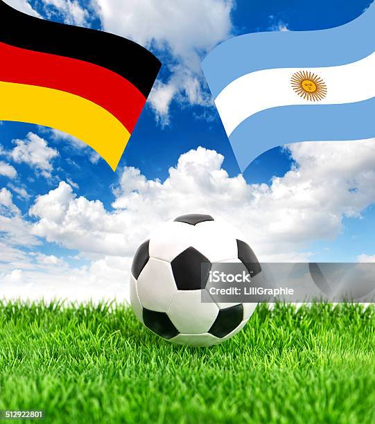 Soccer Ball On Grass And Flags Of Germany And Argentina Stock Photo - Download Image Now