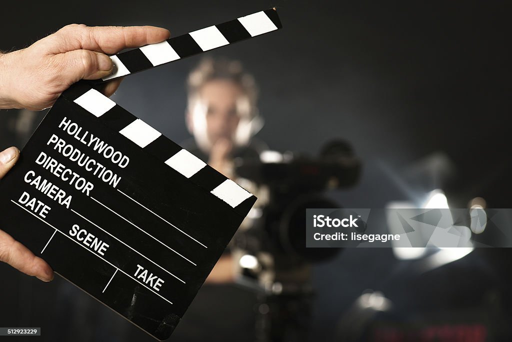 Cameraman on set Film Slate Stock Photo