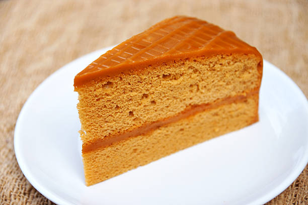 istock Vanilla cake on wood and canvas. 512923241