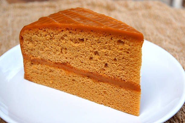 istock Vanilla cake on wood and canvas. 512923251