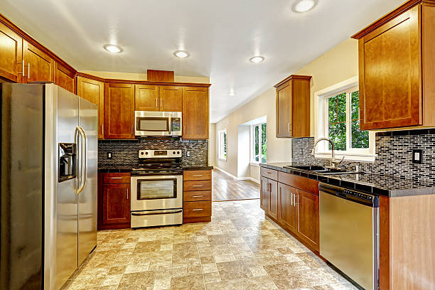 istock Kitchen with black granite tops and wooden cabinets 512923465