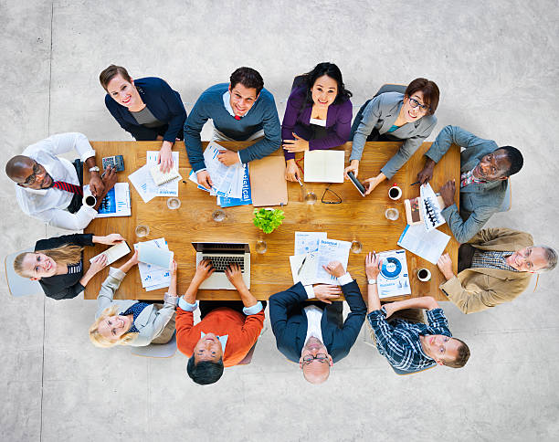 istock Multiethnic Group of People in a Meeting Looking Up 512923961