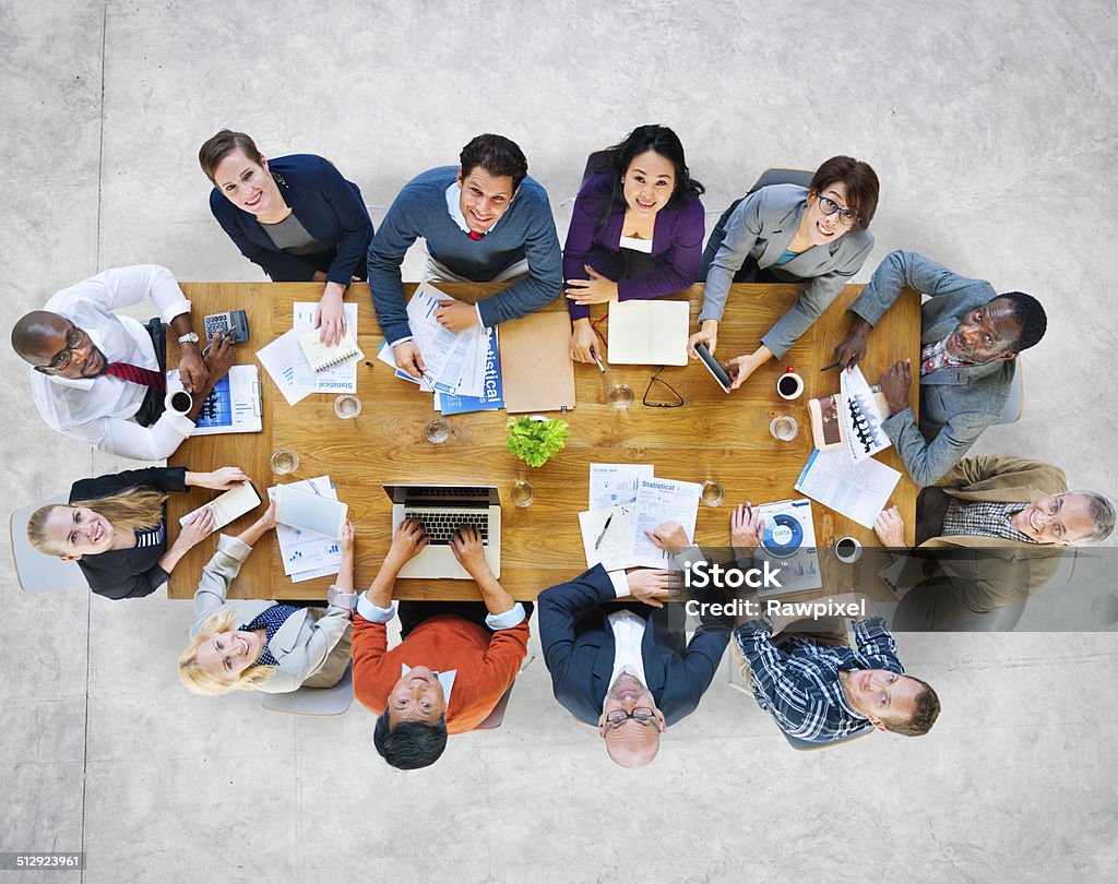 Multiethnic Group of People in a Meeting Looking Up Looking Up Stock Photo