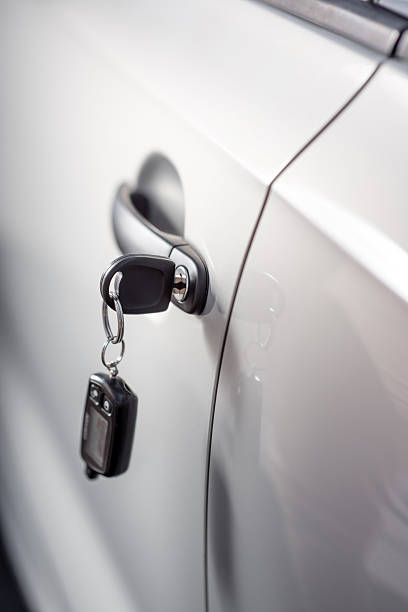 istock Car key in the door lock 512924439