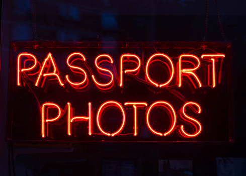 A sign advertising Passport Photos