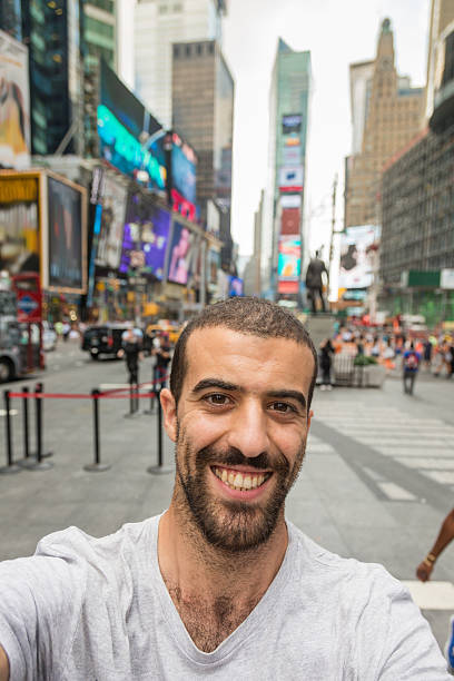 istock Young Man Taking Selfie in Times Square 512938993