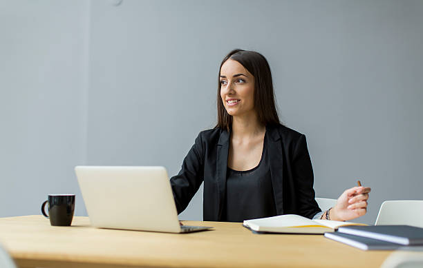 istock Young woman in the office 512939937