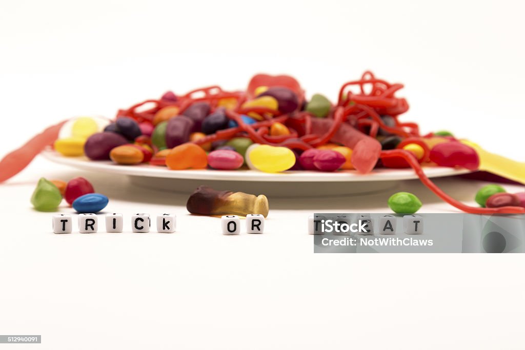 Halloween Trick or Treat with a dish of candy Halloween Trick or Treat with a dish of candy on a white background Insect Stock Photo