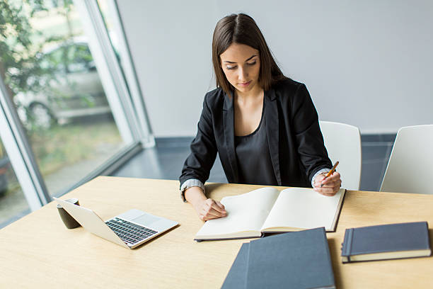 istock Young woman in the office 512940167