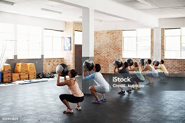 Poised For Action Stock Photo - Download Image Now - Exercise Class, Medicine Ball, 20-29 Years