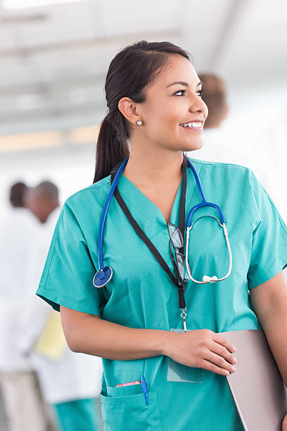 istock Confident happy hospital nurse gazing out window during shift 512942153