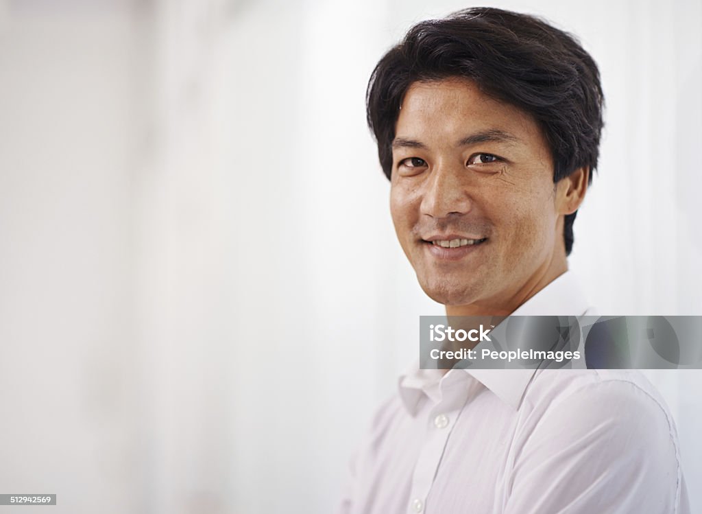 He's got what it takes to be a leader Portrait of a handsome businessman smiling at the camera East Asian Ethnicity Stock Photo