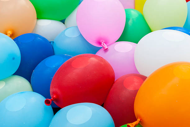 istock colorful rubber balloons containing water, red, green, yellow 512943247