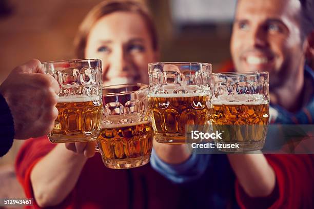 Friends Toasting With Beer Stock Photo - Download Image Now - Apres-Ski, Dusk, Restaurant