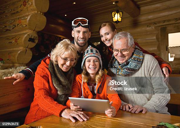 Family Using Digital Tablet Stock Photo - Download Image Now - Winter, Family, Digital Tablet