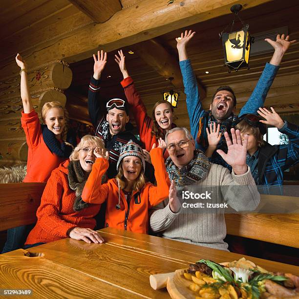 Group Of People In Mountain Restaurant Stock Photo - Download Image Now - Family, Friendship, Senior Adult