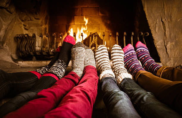 istock Friends sitting by the fireplace 512943535