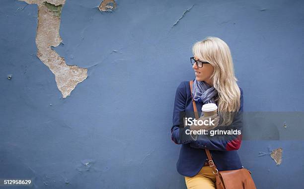 Smiling Young Lady Standing At The Wall Outdoors Stock Photo - Download Image Now - Adult, Adults Only, Beautiful People