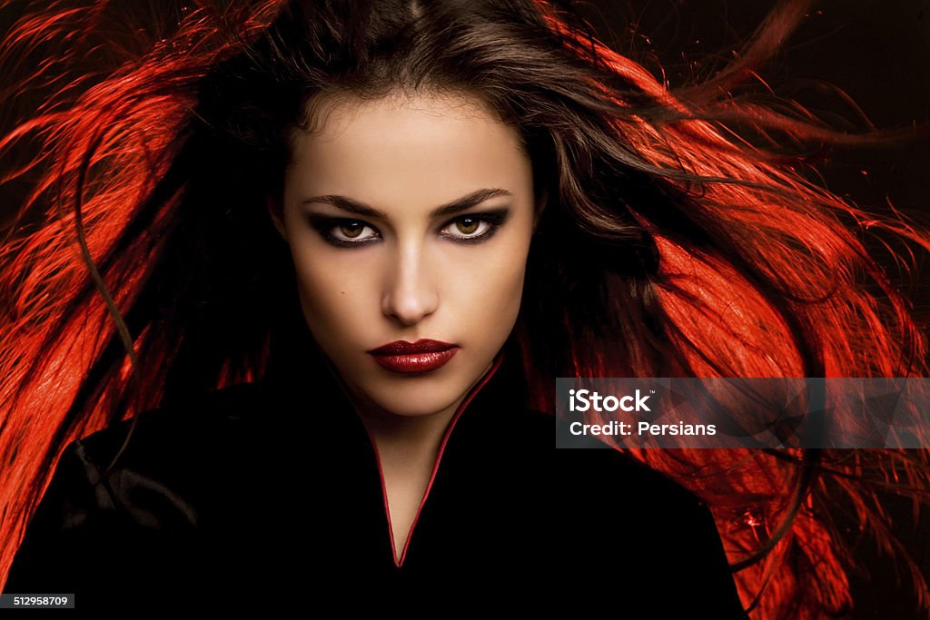 woman portrait beautiful long hair young woman portait with dark makeup, studio Women Stock Photo
