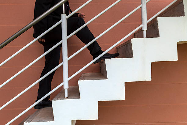 istock businessman leaps on stair, big step, raise fast, up, high 512959191