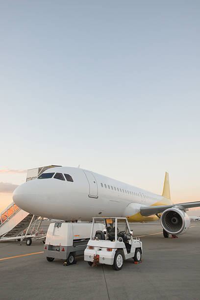 istock Airplane on airport runway at dusk 512959343