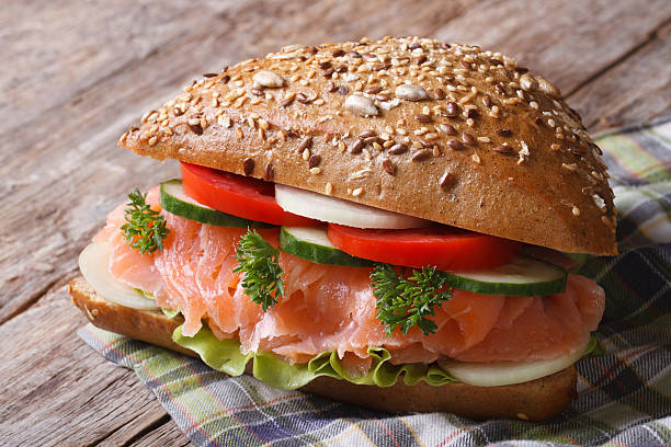 istock Delicious sandwich with salmon and vegetables close up 512959825