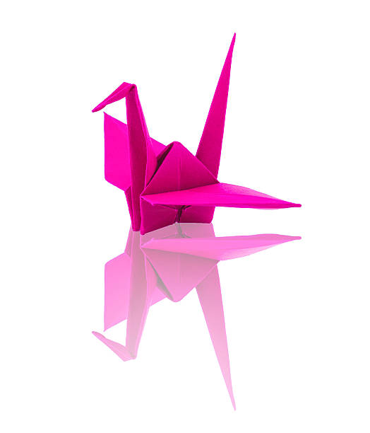 istock origami pink paper heart with swing on white background 512960733