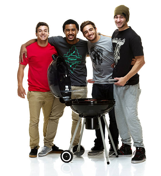 istock Social group of young men having a BBQ 512962209