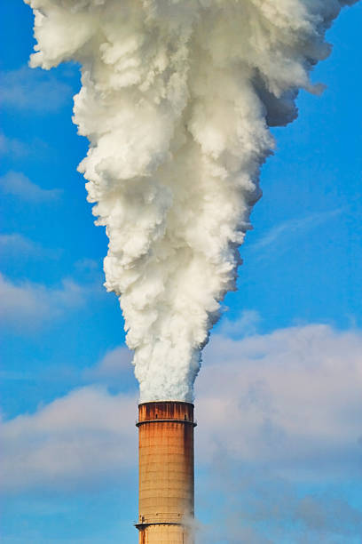 istock Smoke bellowing from smoke stack of a electic power plant 512962347