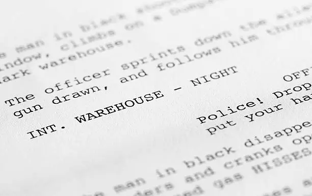 Close-up of a page from a screenplay or script in proper Hollywood format, with generic text written by the photographer to avoid any copyright issues.