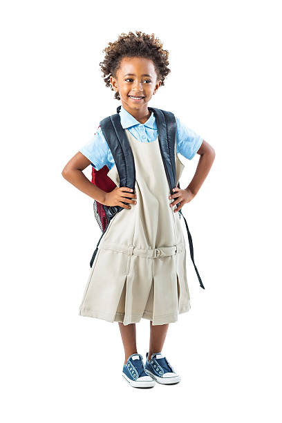 istock Cute private school kindergarten student standing with hands on hips 512963359