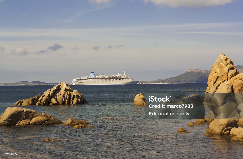 Cruise ship in Olbia Olbia, Sardinia, Italy - September 15th 2014 Thomson Dream cruise ship navigating in the Tyrrhenian Sea near Olbia. Business Stock Photo