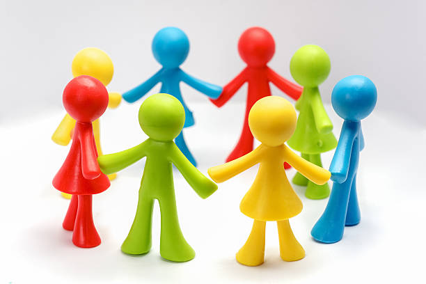 istock Colourful children holding hands in a circle 512965236