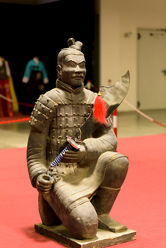 Bologna, Italy - February 27, 2016: at the fair Festival of the East in Bologna, Chinese warrior statue with sword