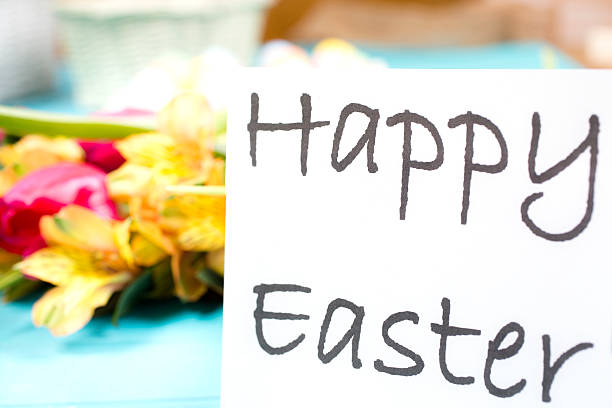 istock Flowers on blue wood background with Happy Easter sign. 512969636