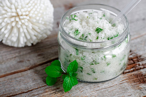 istock Homemade sugar scrub with mint leaves and essential mint oil 512970578