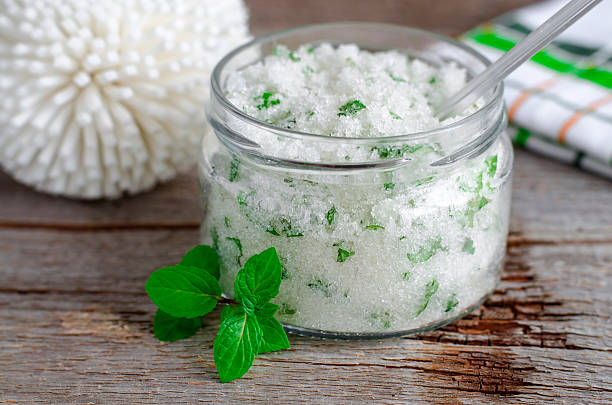 istock Homemade sugar scrub with mint leaves and essential mint oil 512970698