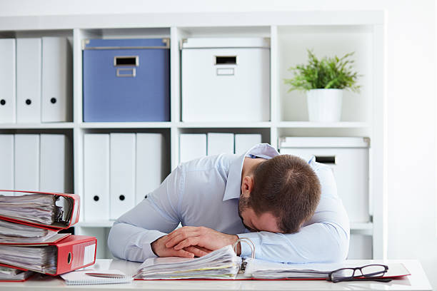 istock Tired young businessman sleeping 512971360