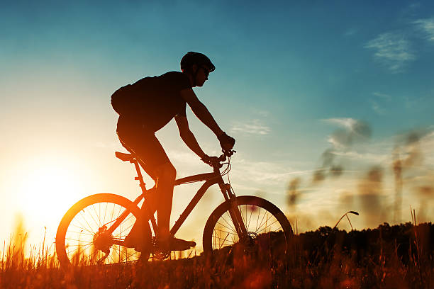 istock Rider on Mountain Bicycle it the field 512975170