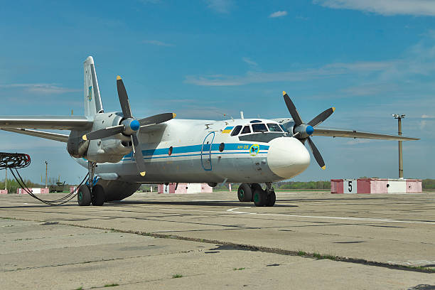 Ukrainian Air Force An-26 Vasilkov, Ukraine - April 24, 2012: Ukrainian Air Force An-26 cargo plane being prepared for the engine start antonov an 26 stock pictures, royalty-free photos & images