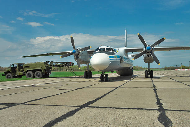Ukrainian Air Force An-26 Vasilkov, Ukraine - April 24, 2012: Ukrainian Air Force An-26 cargo plane being prepared for the engine start antonov an 26 stock pictures, royalty-free photos & images