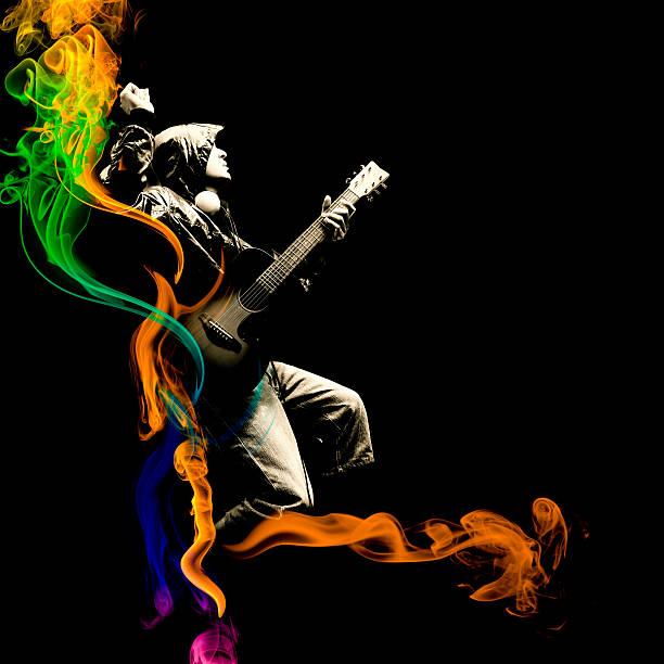 istock asian young musician playing guitar on multi colour fire 512977134