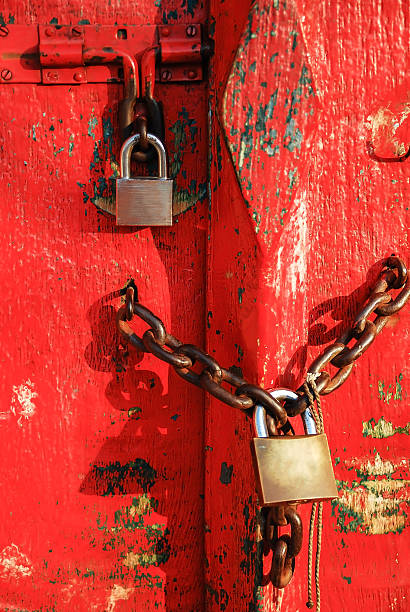 istock vintage lock on red wooden door background 512978410