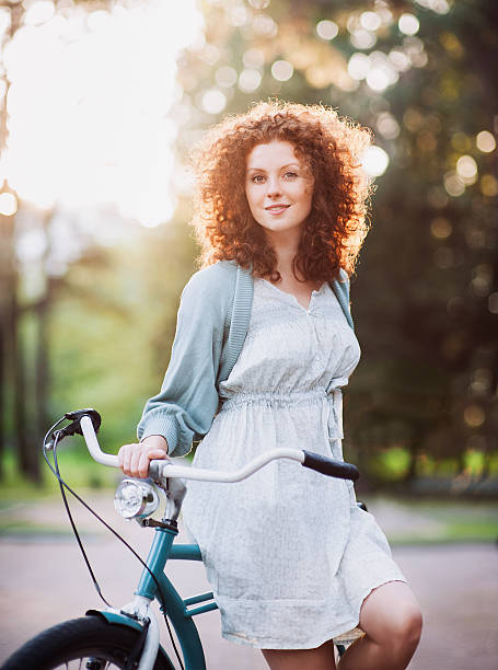 istock Beautiful woman with bike 512978430